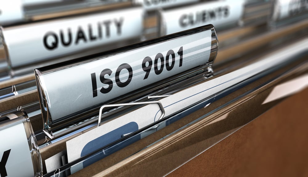 Photo of a set of file folders with one folder labelled Quality Standards ISO 9001
